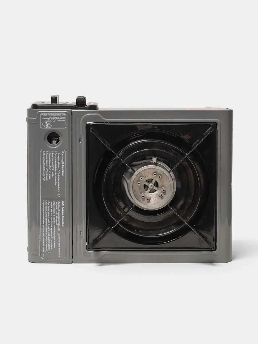 Coleman Classic 1-burner butane camping stove with push-button ignition and wind baffles bottom view