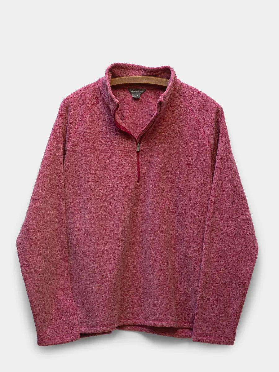 womens quarter zip fleece in a strawberry heathered pink on white background.