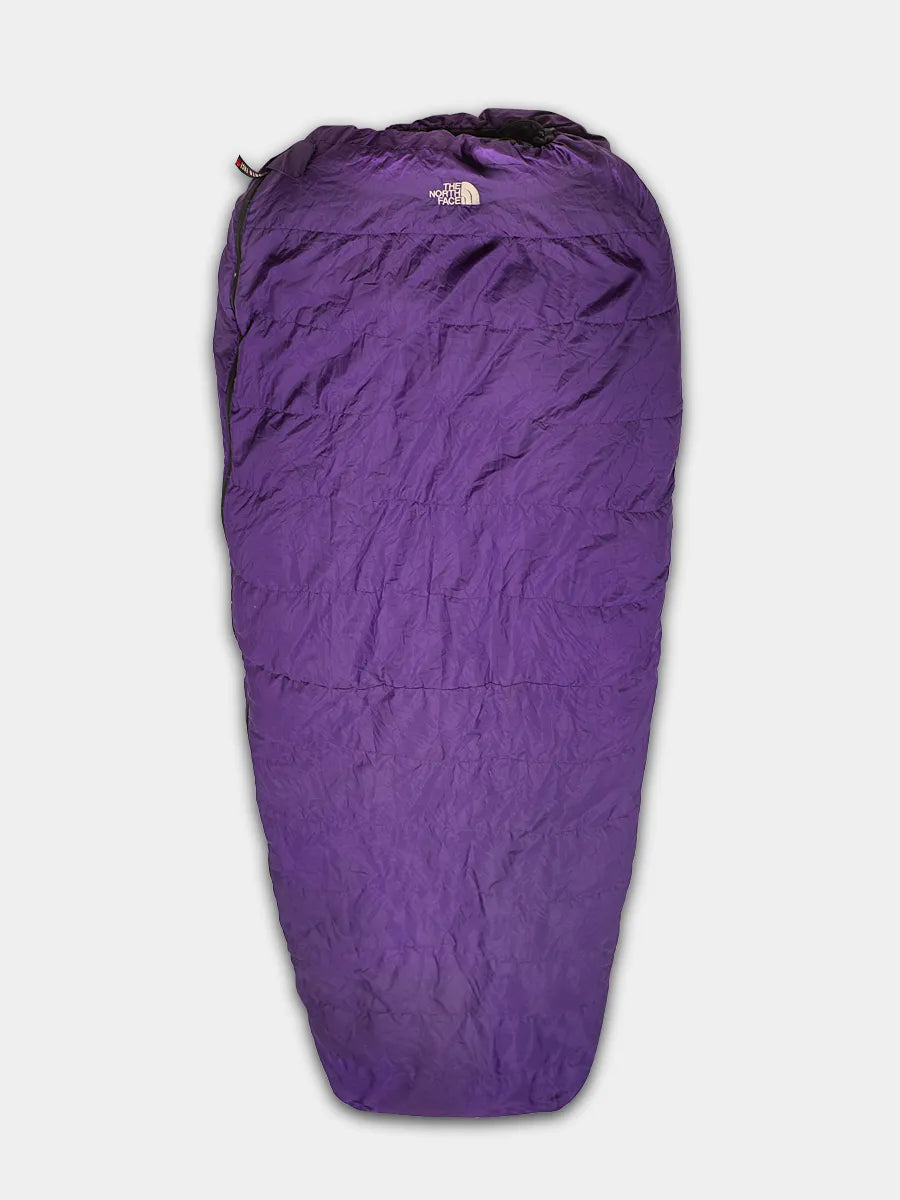 The North Face 3 Season Sleeping Bag in Purple with Black lining shown fully zipped.