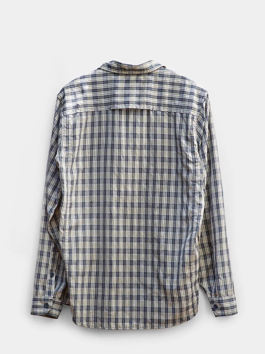 Back view of Navy/Grey plaid Royal Robbins hiking shirt.
