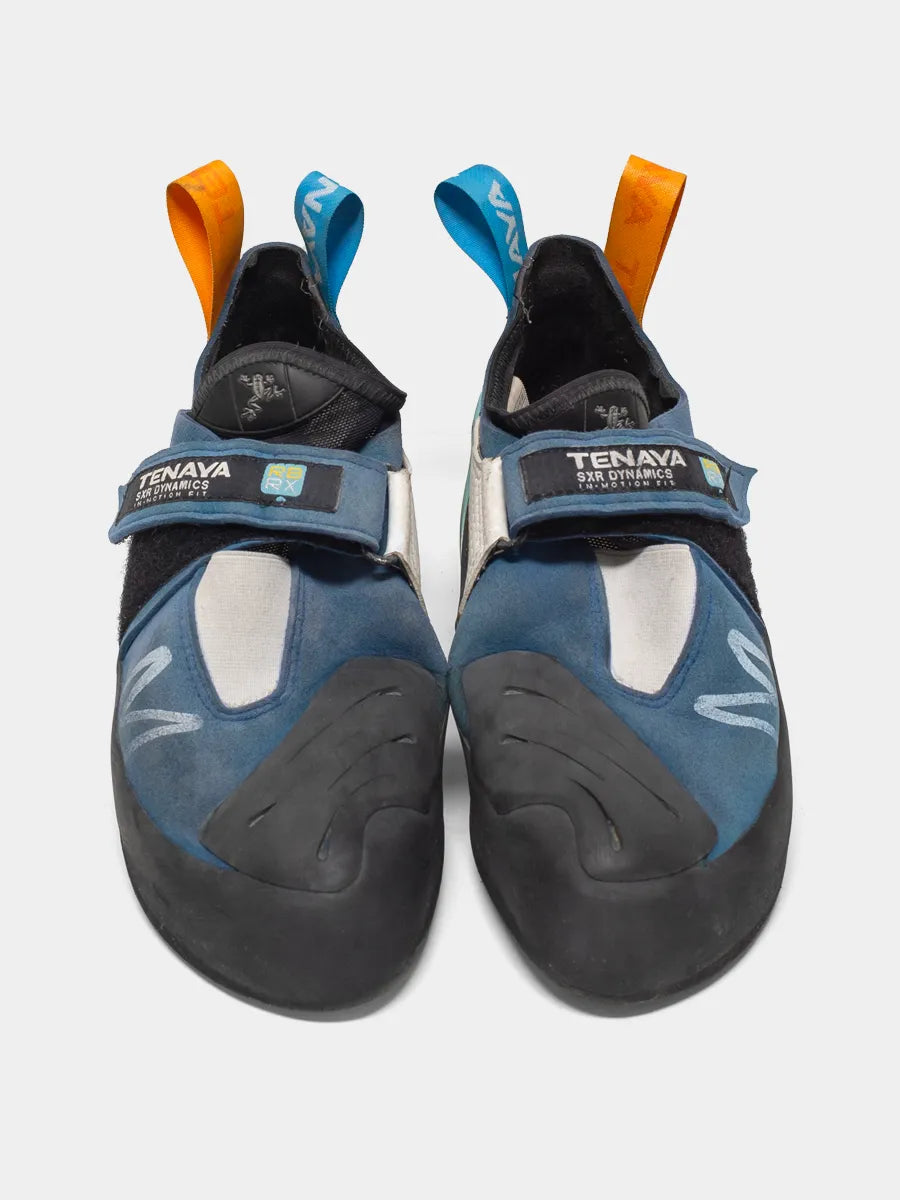 Three Quarter view of Tenaya Mastia Climbing shoe pair. Top of Soles are Sea Blue with Light Blue and Orange contrast details.