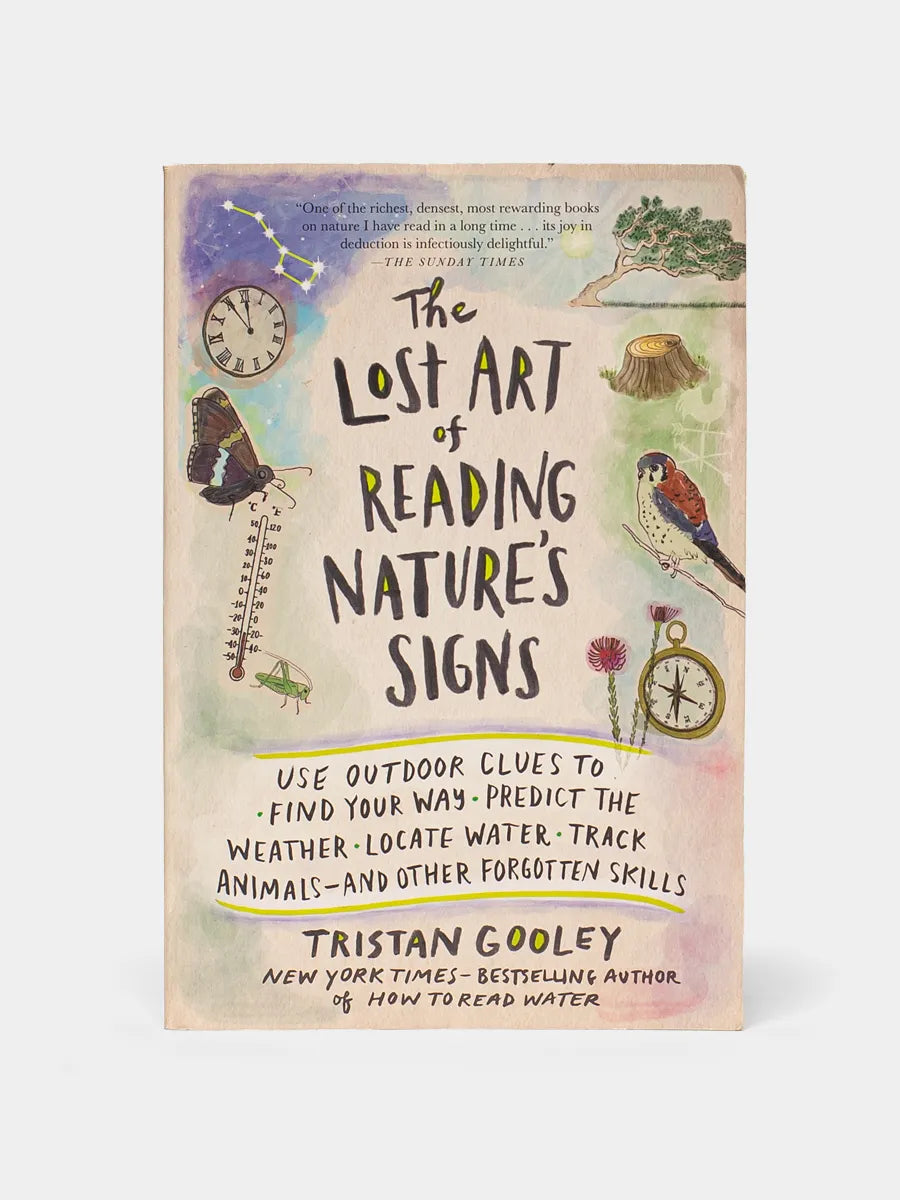 Front cover of The Lost Art of Reading Nature Signs on a white background.