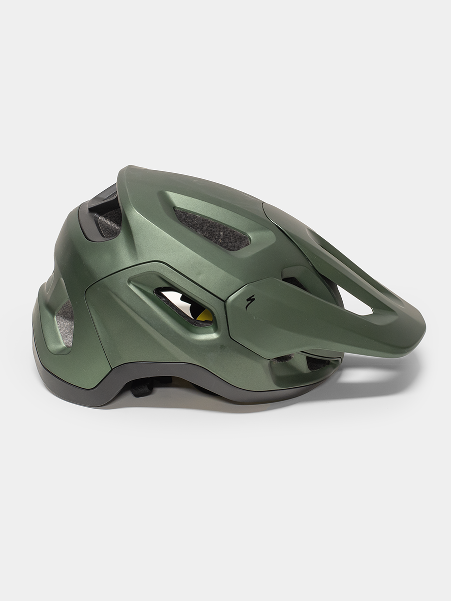 Green and black helmet on a white background