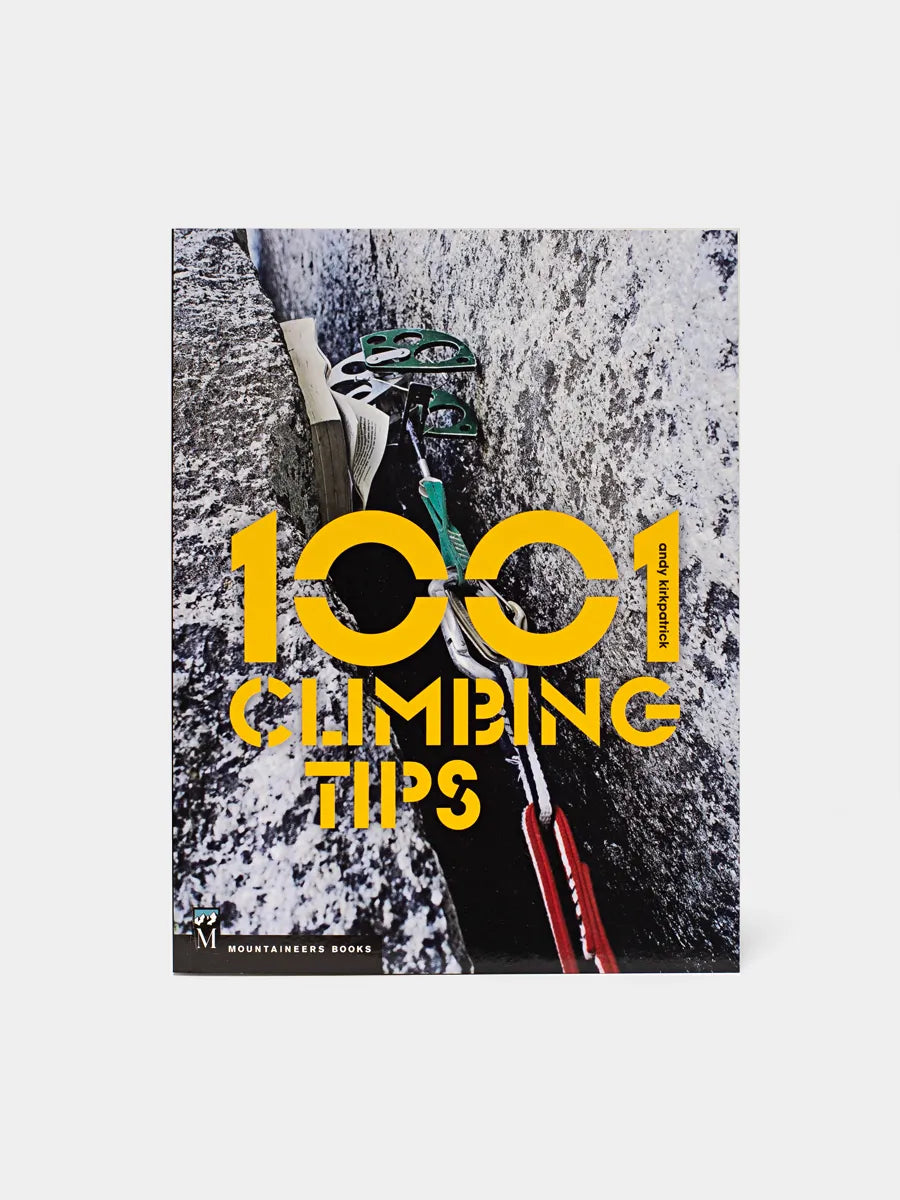 A cover image of a book titled '1001 Climbing Tips', featuring a close-up photograph of climbing equipment with the dominant colors being black, red, and white, and including the text '1001 CLIMBING TIPS' in bold, yellow letters.