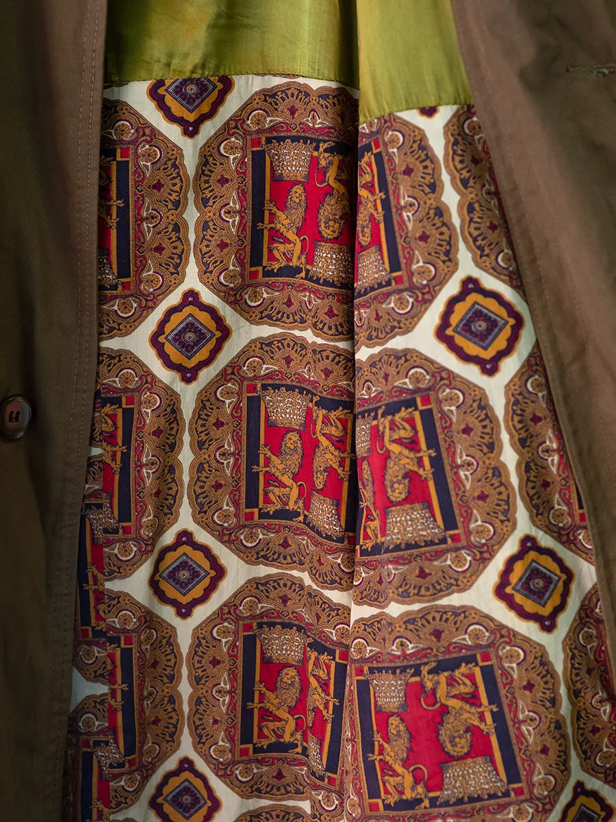 Detailed View of Inner Panel, Vintage Mid Length Trench with a retro lion geometric patterned lining.