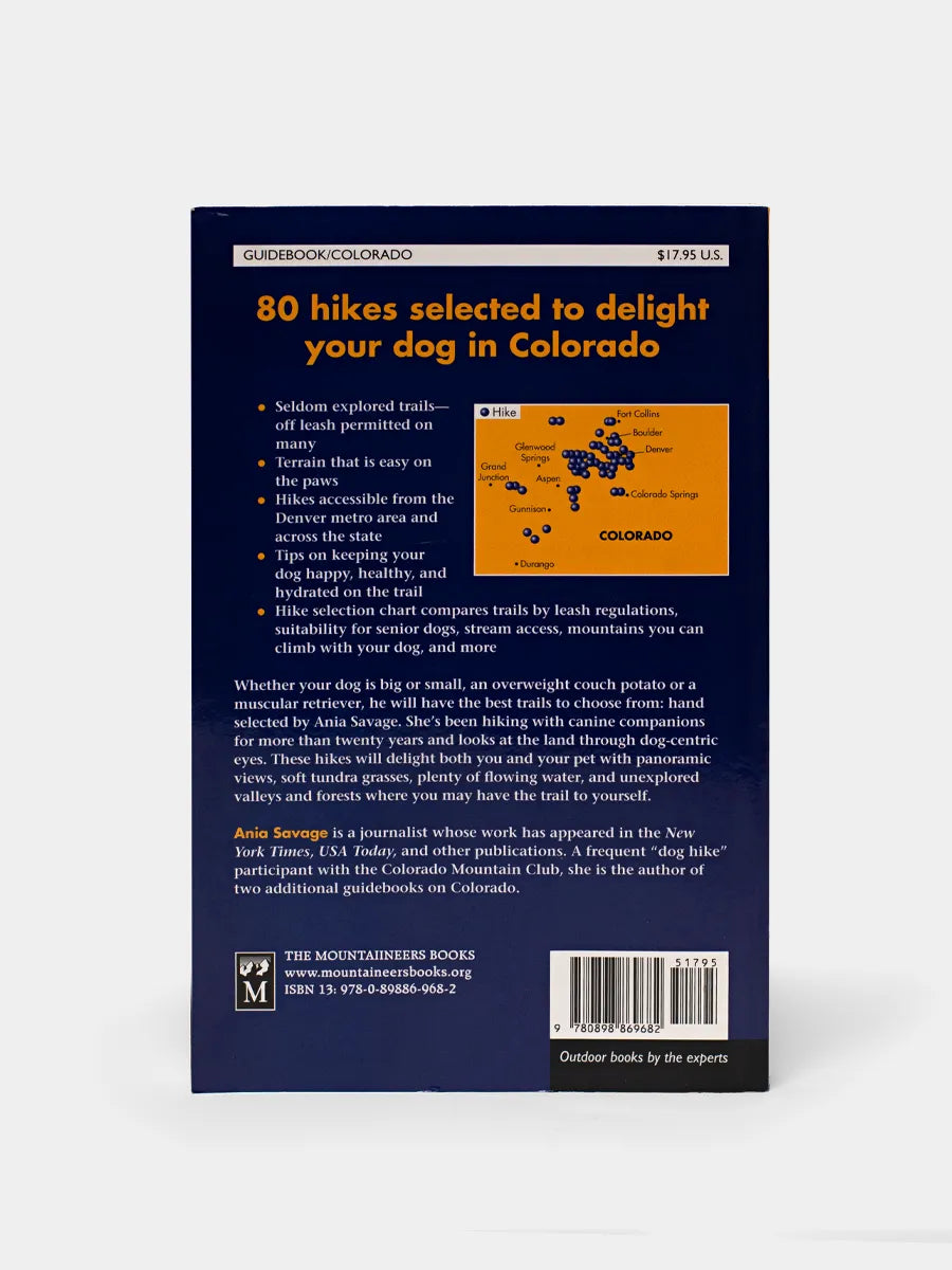 Back book cover for 'Best Hikes with Dogs Colorado' featuring an image of a golden retriever dog smiling.