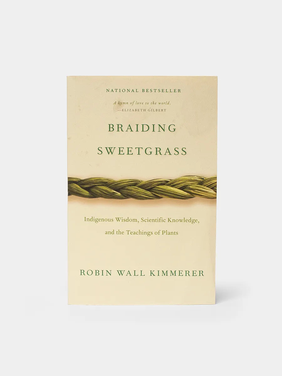Book cover of 'Braiding Sweetgrass' by Robin Wall Kimmerer on a beige background