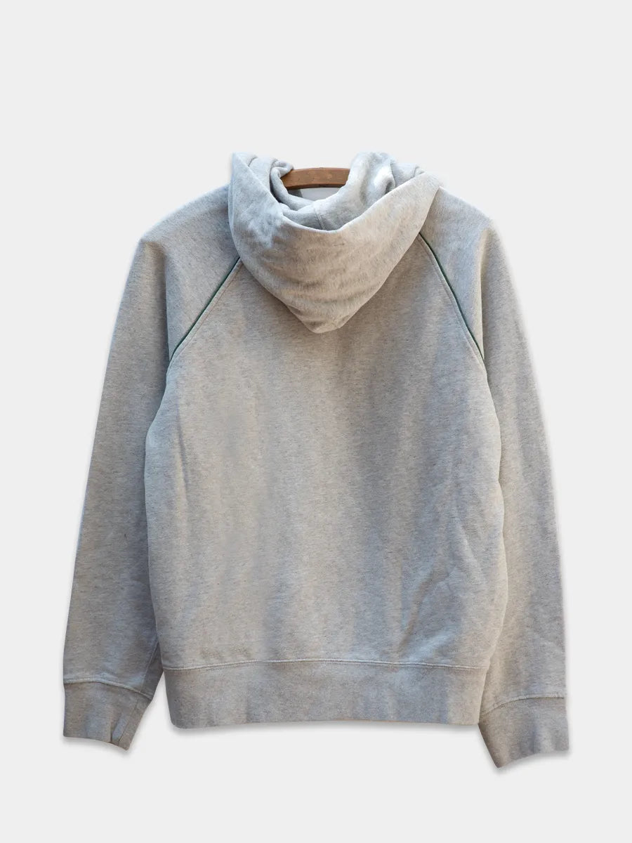 back view of heather grey sweatshirt with green piping detail, raglan sleeve