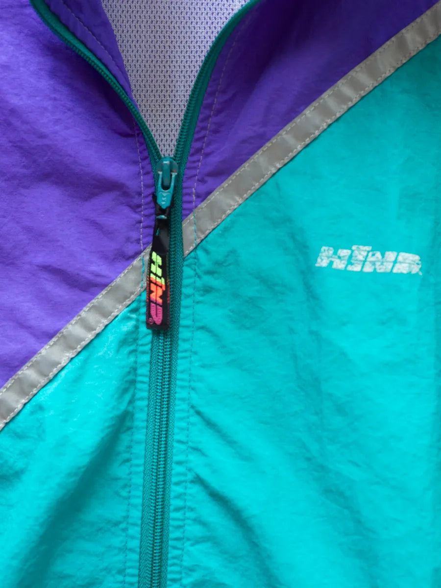 HIND zip pull tab detail in black with neon logo