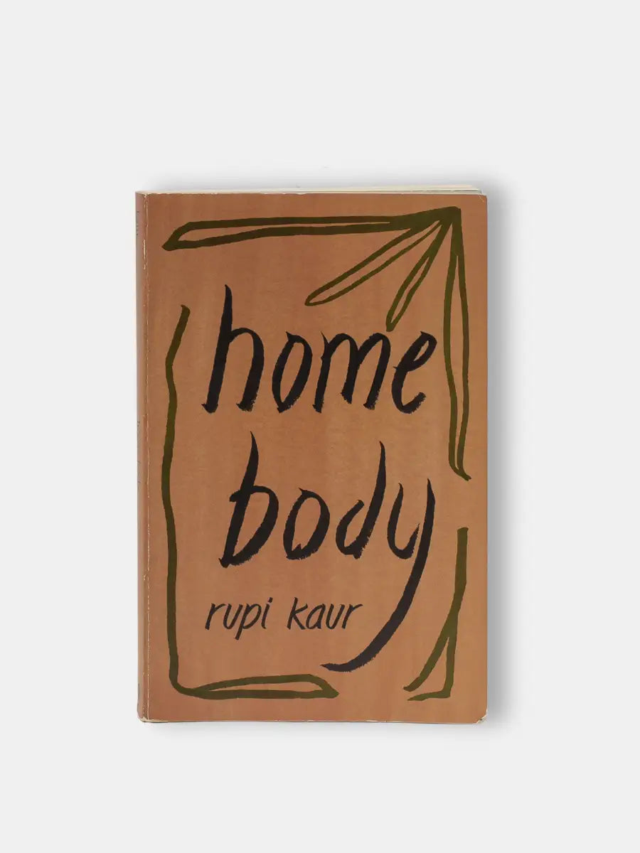 Book titled 'home body' by Rupi Kaur with a brown cover and green leaf design on a white background