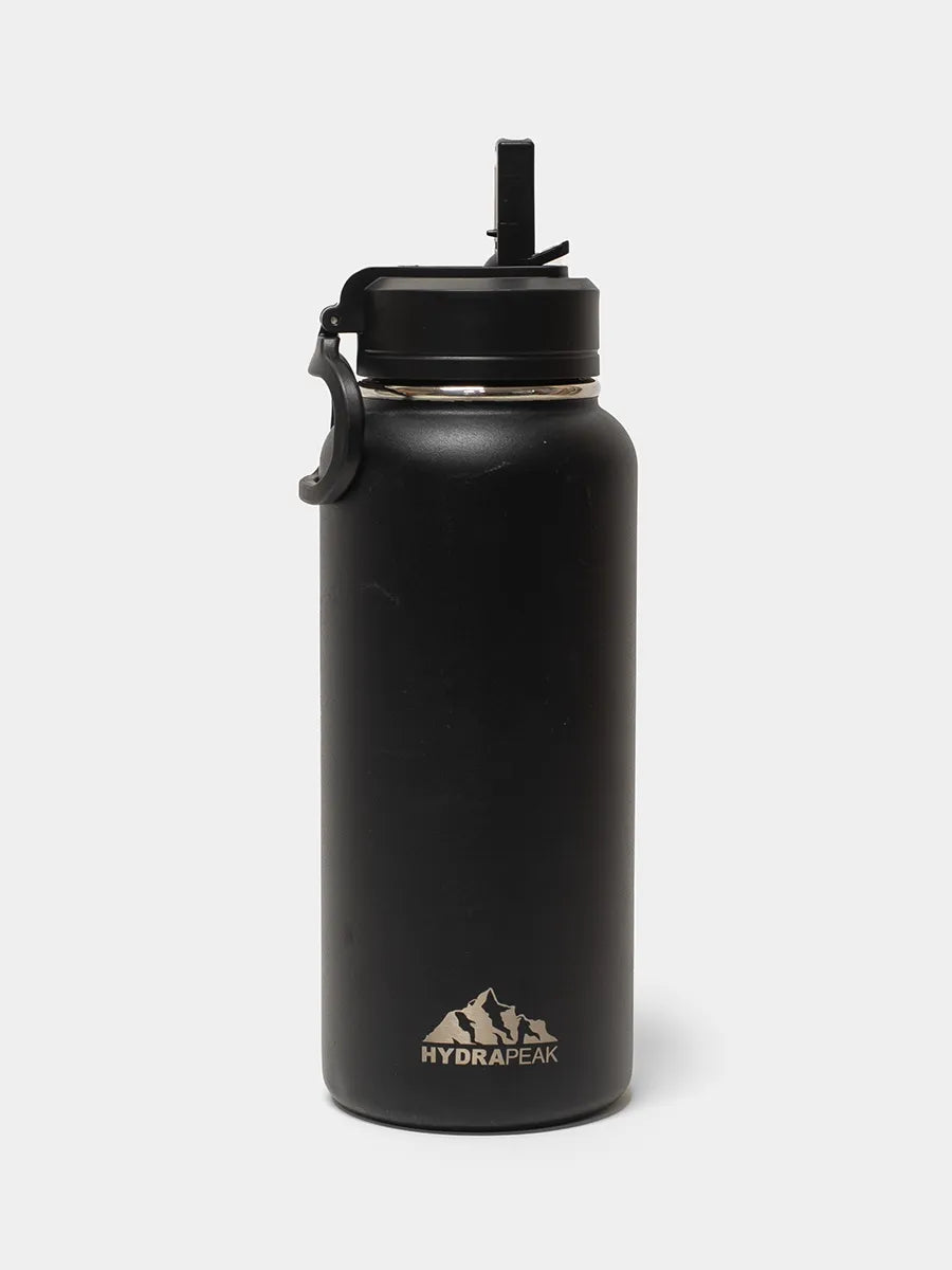 Black water bottle with a straw lid on a white background