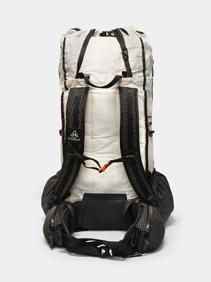 Back view of Hyperlite Mountain Gear Unbound 55 ultralight backpack in white and black with padded straps and hip belt pockets
