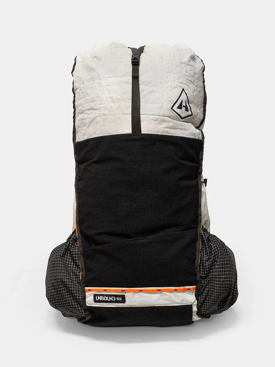Front view of Hyperlite Mountain Gear Unbound 55 ultralight backpack in white and black with logo and side pockets
