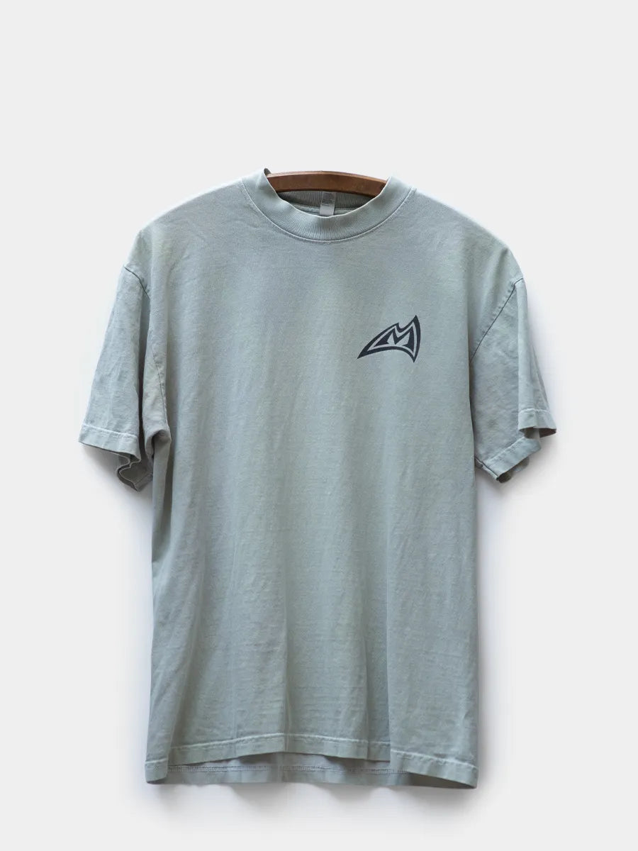 Gray blue tshirt with Mad Rock logo in black at wearer’s left chest.