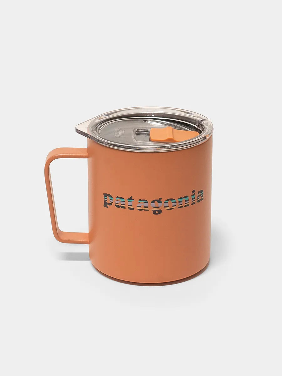 Orange mug with 'Patagonia' branding on a white background