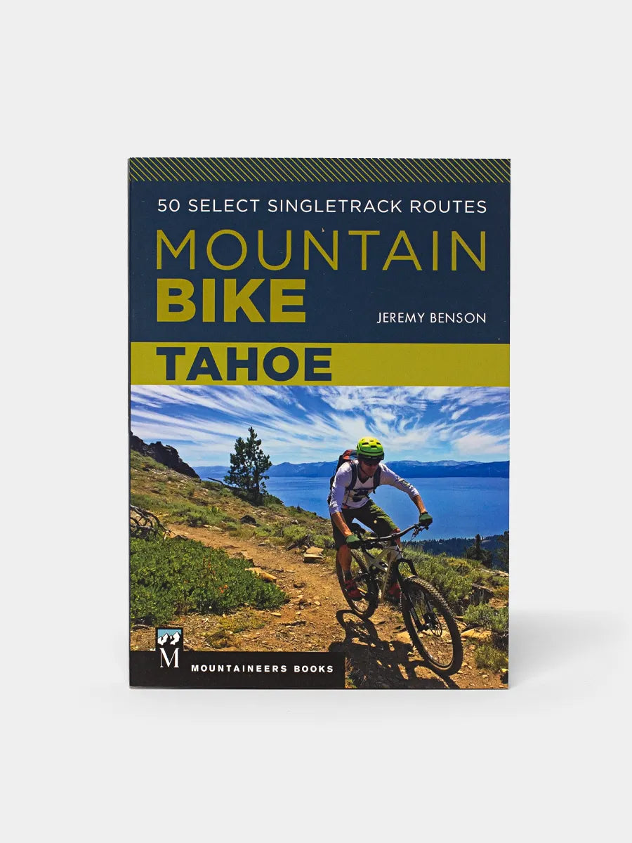 A cover image of a book titled 'Mountain Bike Tahoe' showing a person mountain biking on a trail with trees in the background.