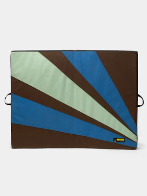 Organic Climbing crash pad fully open. Black with Green and Blue accents.