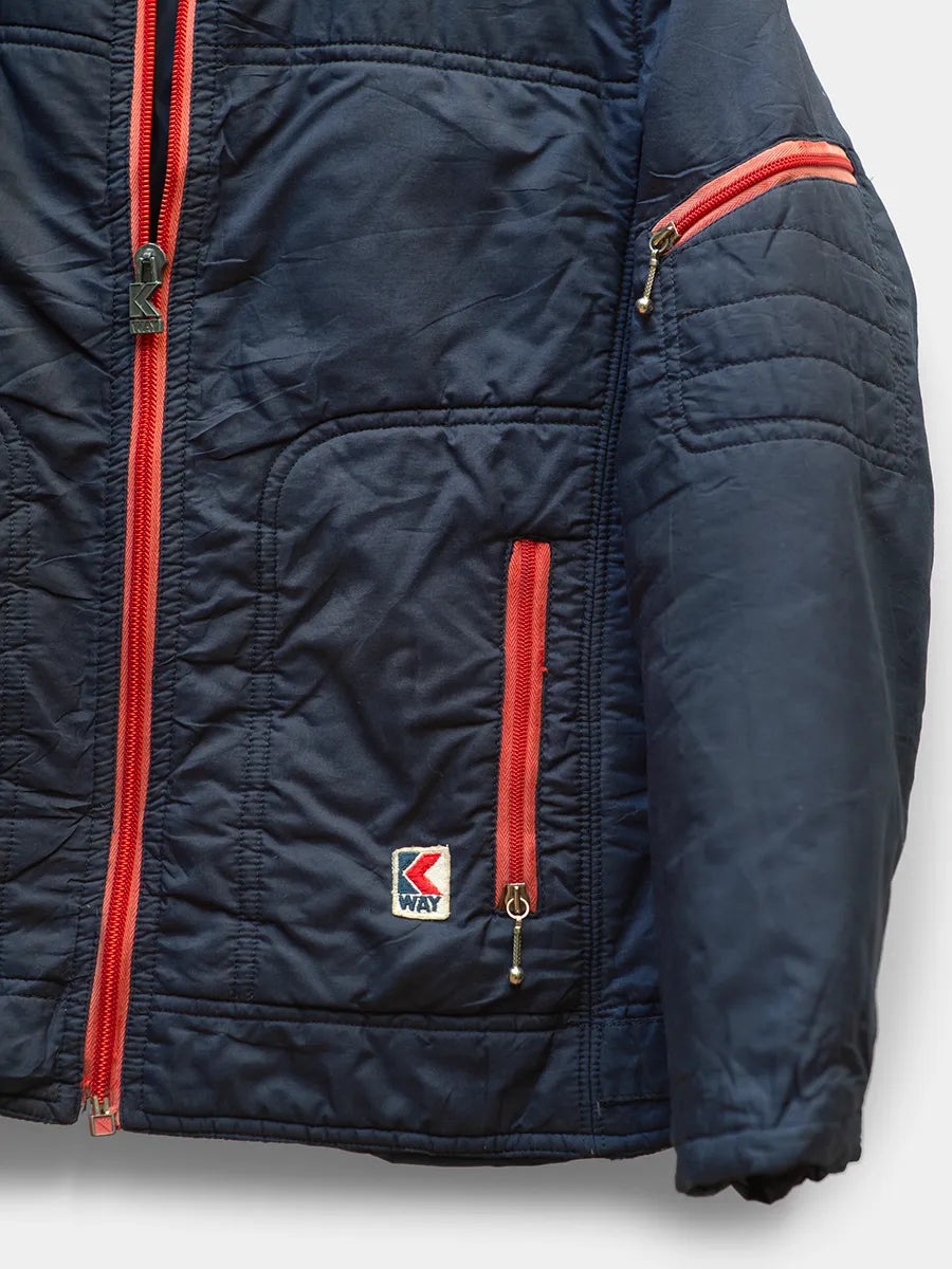 Detailed Front Trim view of Vintage K Way Navy Jacket with Red Zipper Trim.