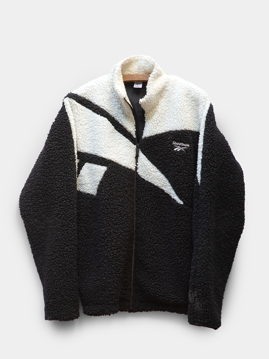 Reebok Pebbled Fleece Full Ziip Jacket in Black and White Geometric Logo Pattern.