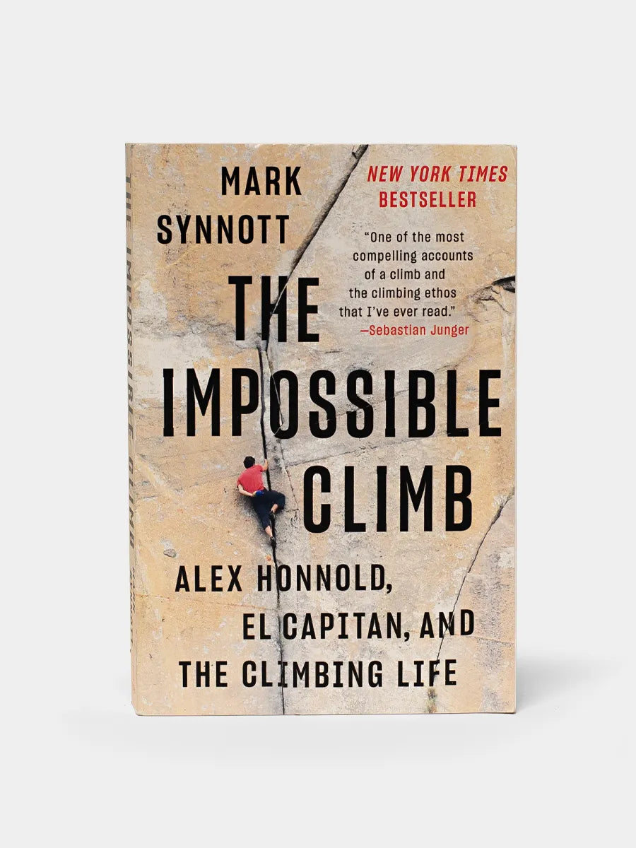 This image displays the cover of a book titled "The Impossible Climb," featuring Mark Synnott, Alex Honnold, and the Climbing Life as sub-titles. The book's cover design is straightforward yet captivating, showcasing a photograph of a climber high up on a precipice, emphasizing the perils and achievements of mountaineering.