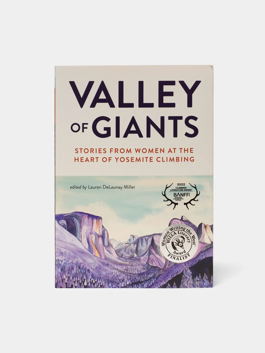 A book titled 'Valley of Giants' featuring a picture of a mountain range in the background. The cover has text and a logo indicating it might be related to climbing and women's experiences.