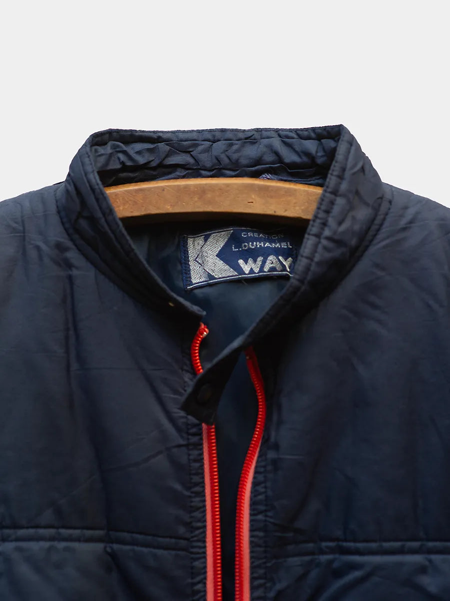 Detail Collar/Label view of Vintage K Way Navy Jacket with Red Zipper Trim.