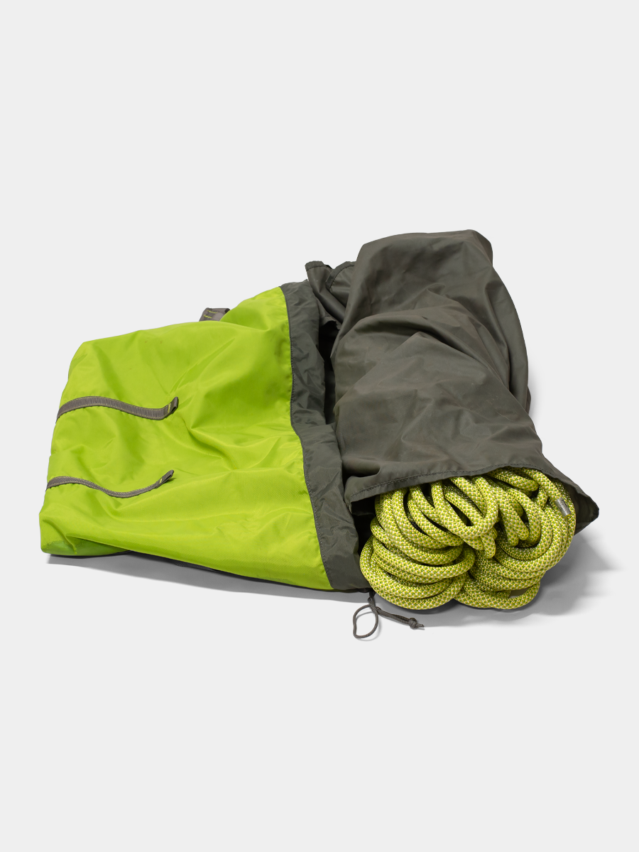 Green and gray bag with yellow rope on a white background