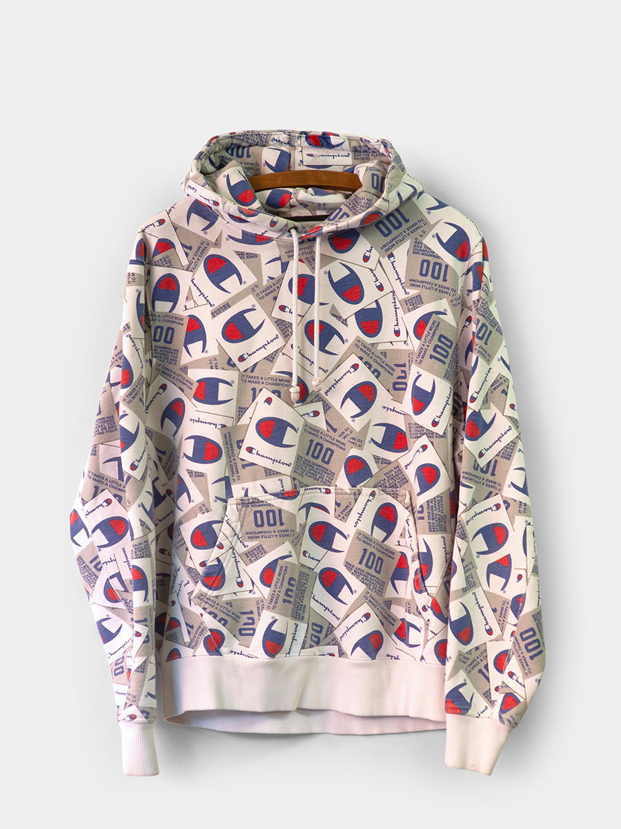 Front view of hoodie with Red/Navy/White Champion logo all over graphic pattern on a white background