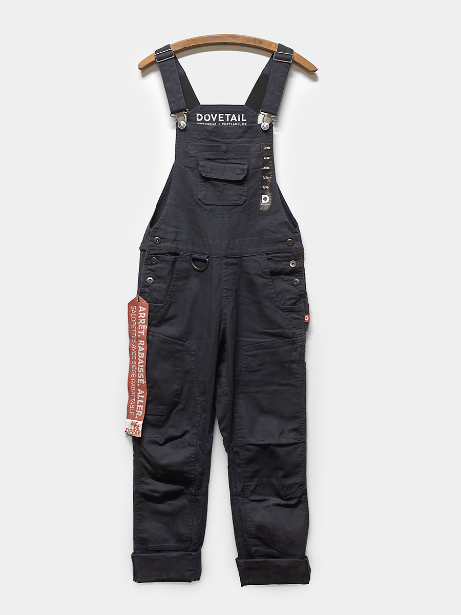 Black overalls with visible branding on a white background