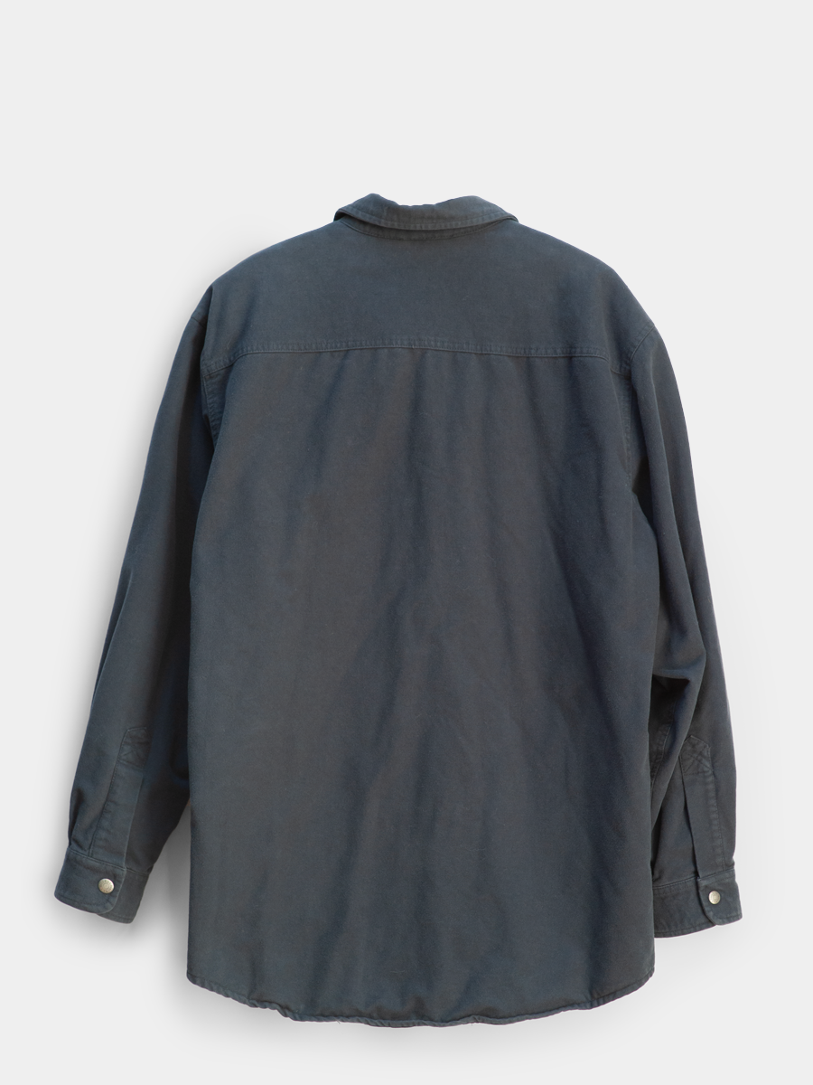 Dark gray shirt on a light gray background
