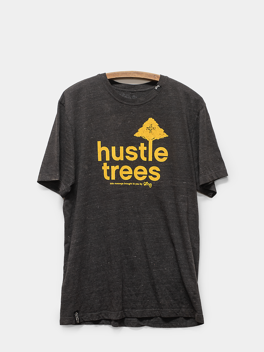 Black t-shirt with yellow 'hustle trees' text and graphic on a white background