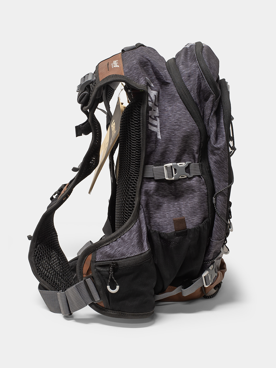 Gray and black hydration vest with visible branding on a light gray background