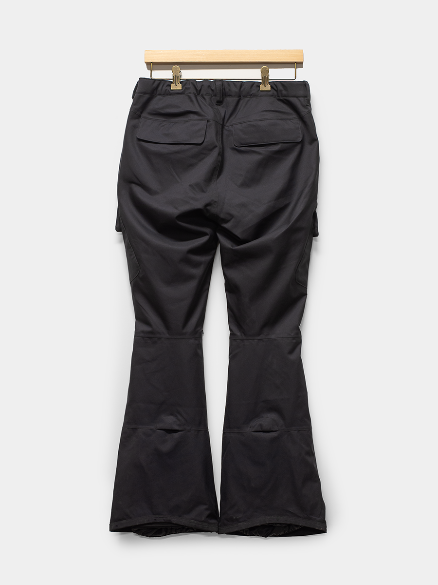 Black pants on a wooden hanger against a white background