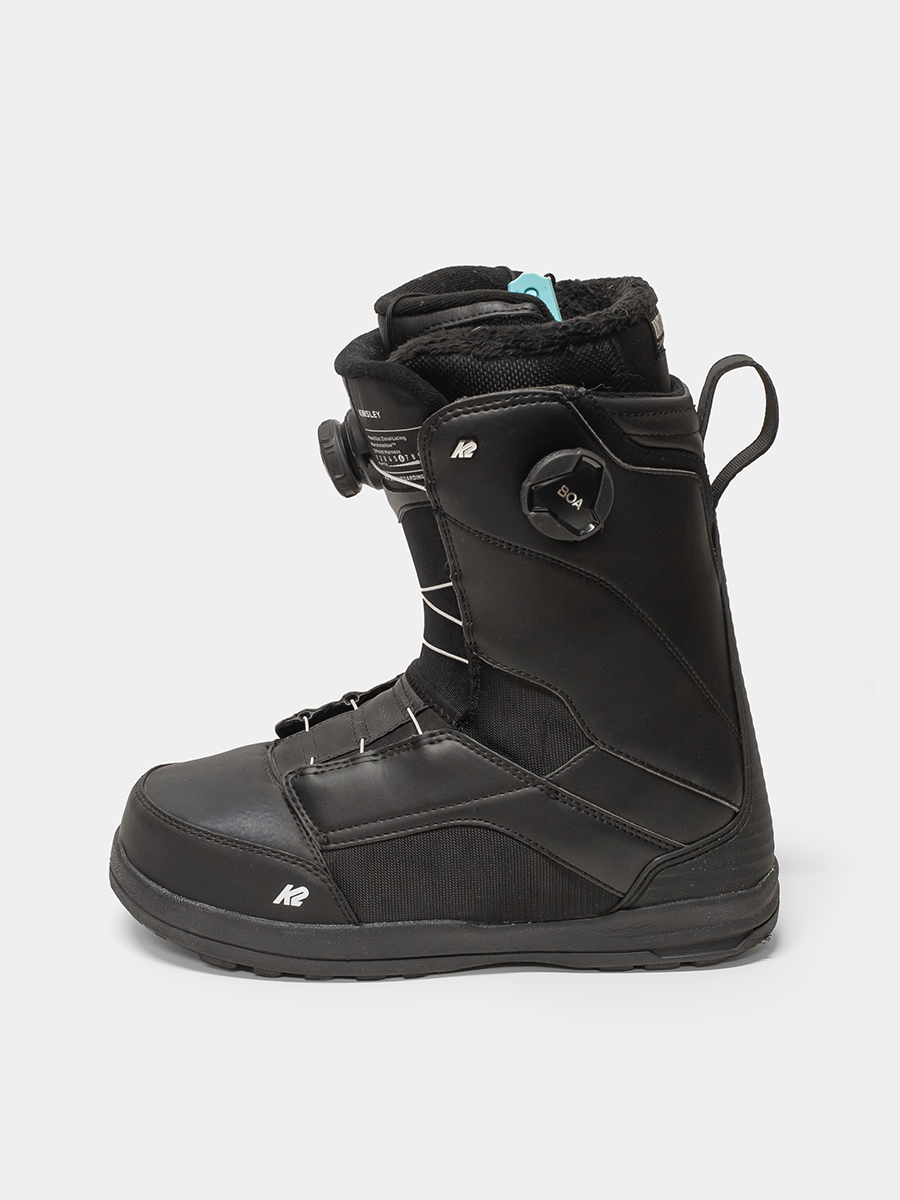 Black snowboard boot with visible branding on a white background
