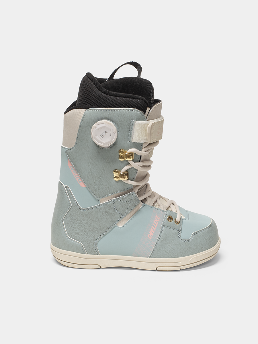 Light blue snowboard boot with beige accents on a white background