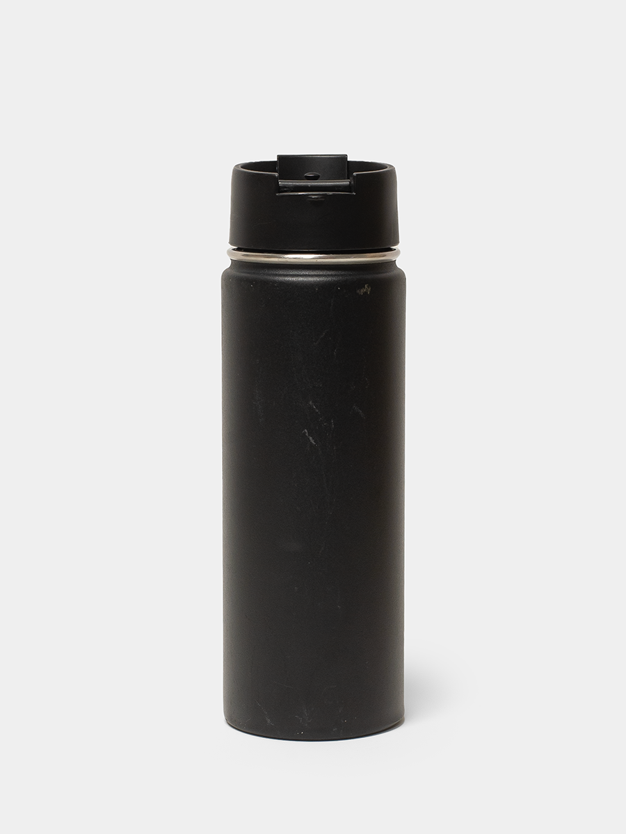 Black water bottle with a cap on a white background