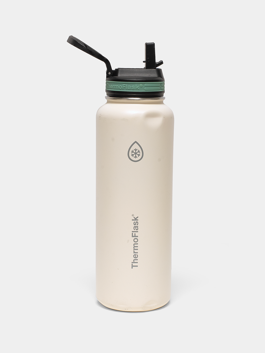 Beige thermos bottle with black lid and straw spout on a white background