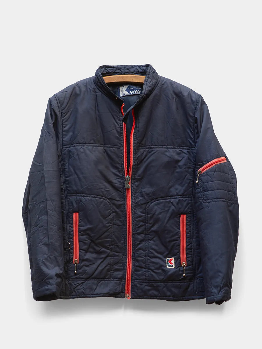 Front view of Vintage K Way Navy Jacket with Red Zipper Trim.